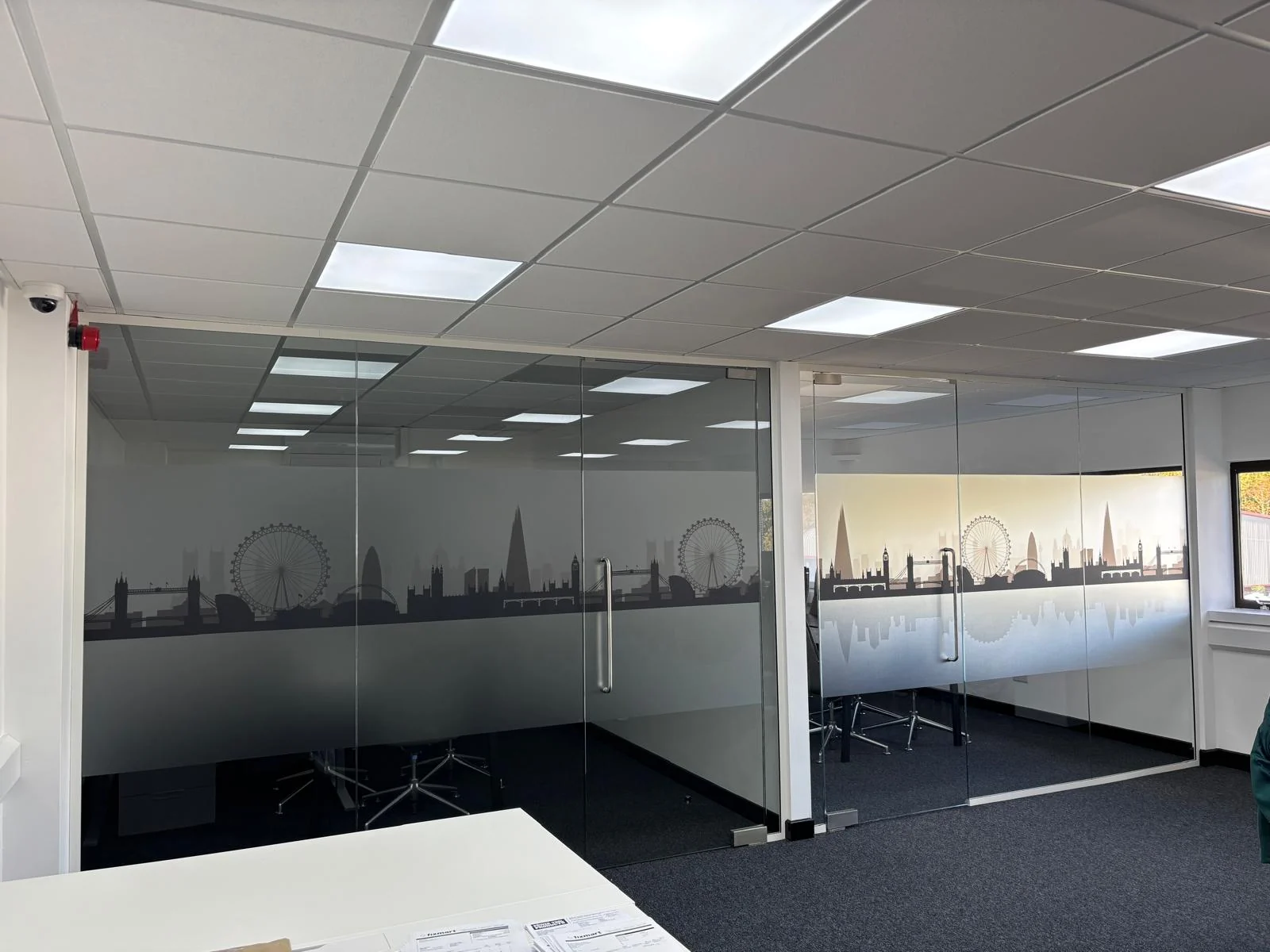 Frosted manifestation vinyl with a London skyline design on glass office partitions